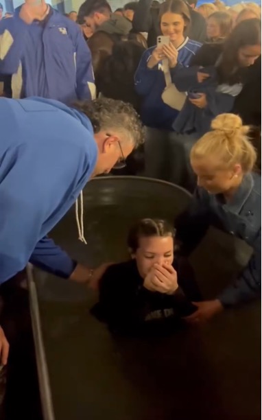 Pastor Jonathan Pokluda baptizes University of Kentucky junior Ruthie Blaine at Rupp Arena on Feb.12, 2025. 