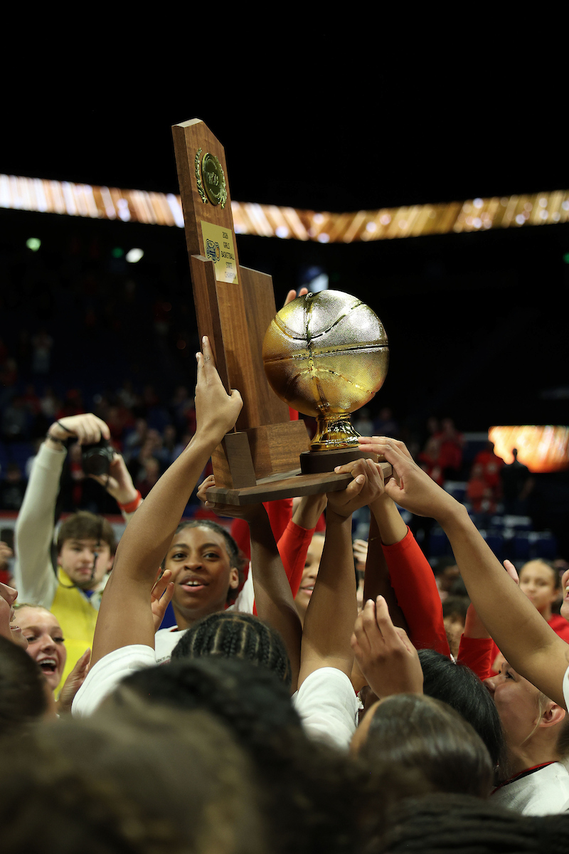 Members of the George Rogers Clark team celebrate with their trophy after their 48-43 victory over Assumption after the championship game of the Clark’s Pump-N-Shop Girls’ Basketball Sweet 16 tournament at Rupp Arena on Saturday, March 14, 2026, in Lexington, Ky. Photo by Sydney Cox