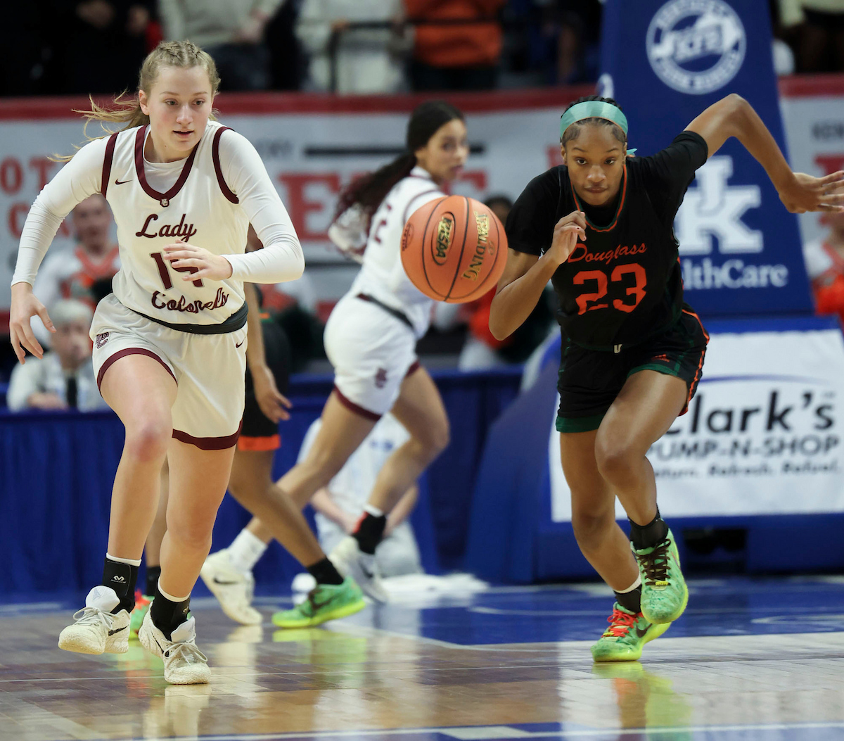 Henderson County high school's Callie Burnett and Frederick Douglass high school's Jaelee Knowles race towards the ball during the KHSAA Clark’s Pump-N-Shop Girls’ Basketball Sweet 16 tournament as Henderson County plays Frederick Douglass at Rupp Arena on Wednesday, March 11, 2026, in Lexington, Ky.. Photo by Kate Bonafede