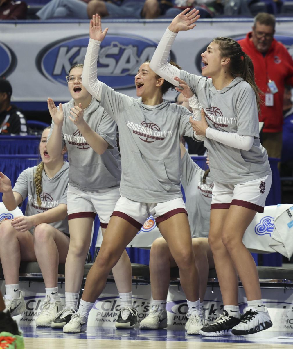 The Henderson County’s bench celebrates a made layup during the KHSAA Clark’s Pump-N-Shop Girls’ Basketball Sweet 16 tournament as Henderson County plays Frederick Douglass at Rupp Arena on Wednesday, March 11, 2026, in Lexington, Ky.. Photo by Kate Bonafede