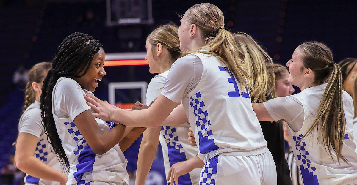 Simon Kenton's Angela Kabeya is greeted by her teammates in a timeout during the third quarter of the Clark’s Pump-N-Shop Girls’ Basketball Sweet 16 tournament as Simon Kenton plays Ashland Blazer at Rupp Arena on Thursday, March 12, 2026, in Lexington, Ky. Photo by Claire Pinar