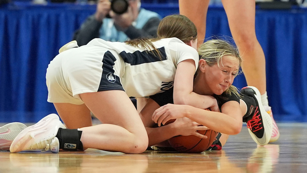 Notre Dame guard Erin McGraw and Taylor County shooting guard Kayley Benningfield wrestle for the ball during the Clark’s Pump-N-Shop Girls’ Basketball Sweet 16 tournament as Notre Dame plays Taylor County at Rupp Arena on Friday, March 13, 2026, in Lexington, Ky. Photo by Peyton Tindall