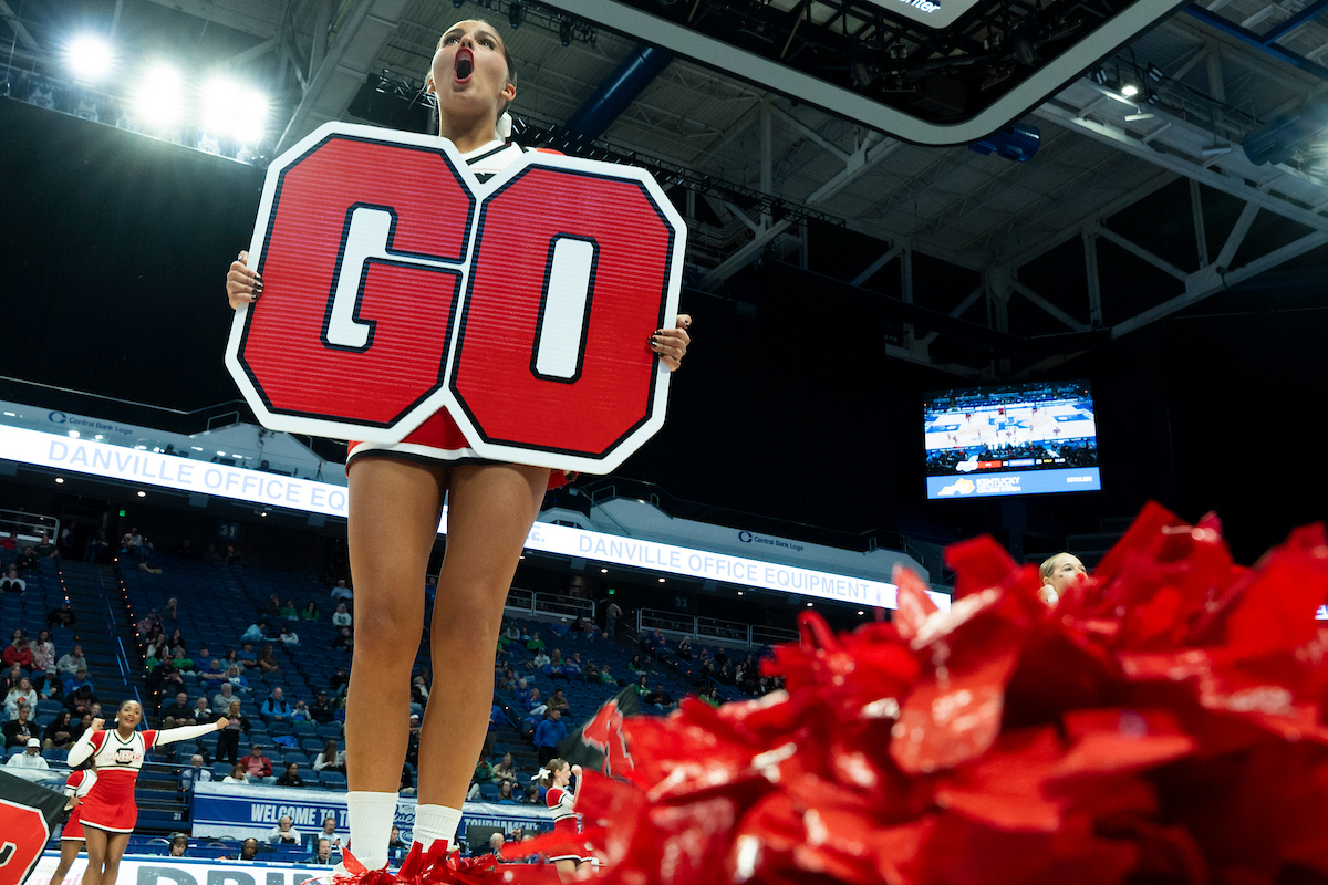 A George Rogers Clark cheerleader holds up a “GO” sign during a cheer half-time performance at the Clark’s Pump-N-Shop Girls’ Basketball Sweet 16 tournament as North Laurel plays George Rogers Clark at  on Thursday, March 12, 2026, in Lexington, Ky. Photo by Elizabeth Hunter.